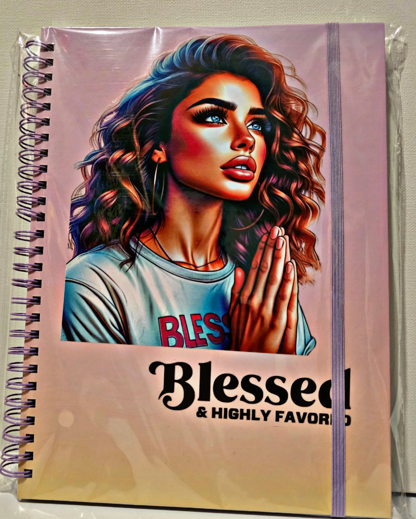 Blessed and highly favored lined journal with elastic closure.