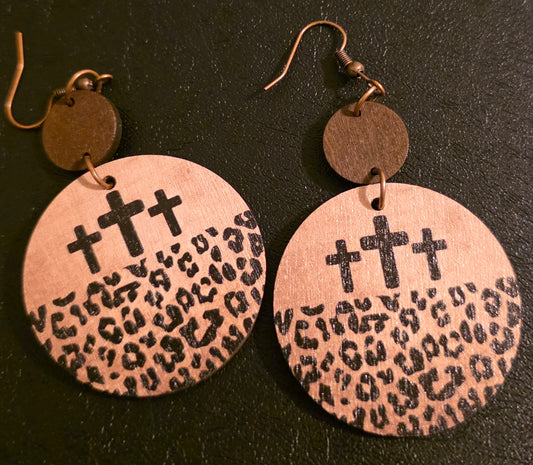 Round wood cross and leopard earrings.